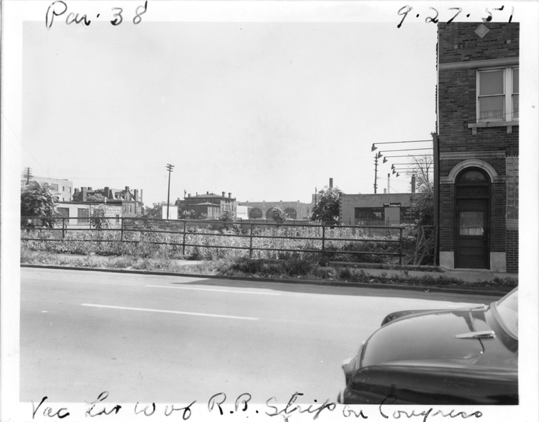 Vacant lot beside railroad tracks under E. Congress