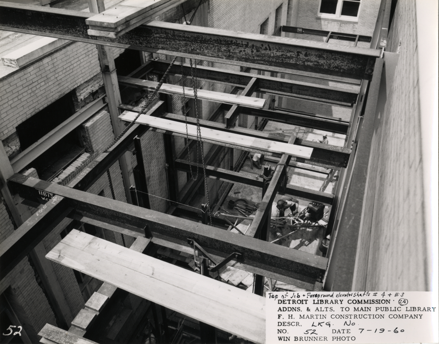 Construction workers in light court, Main Library