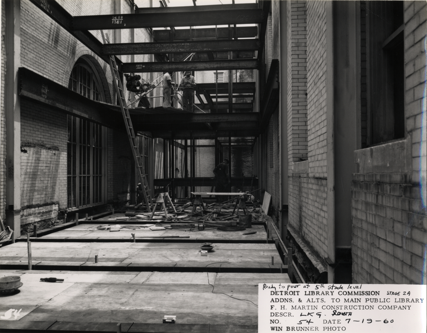 Construction workers in light court, Main Library