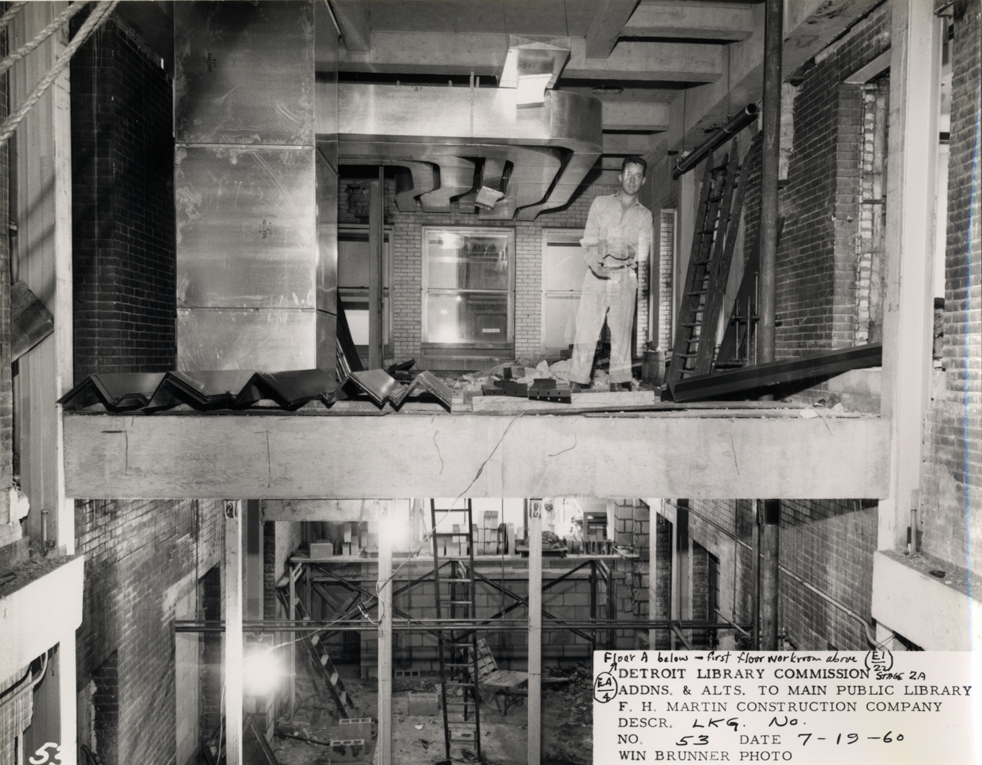 Construction worker in light court, Main Library