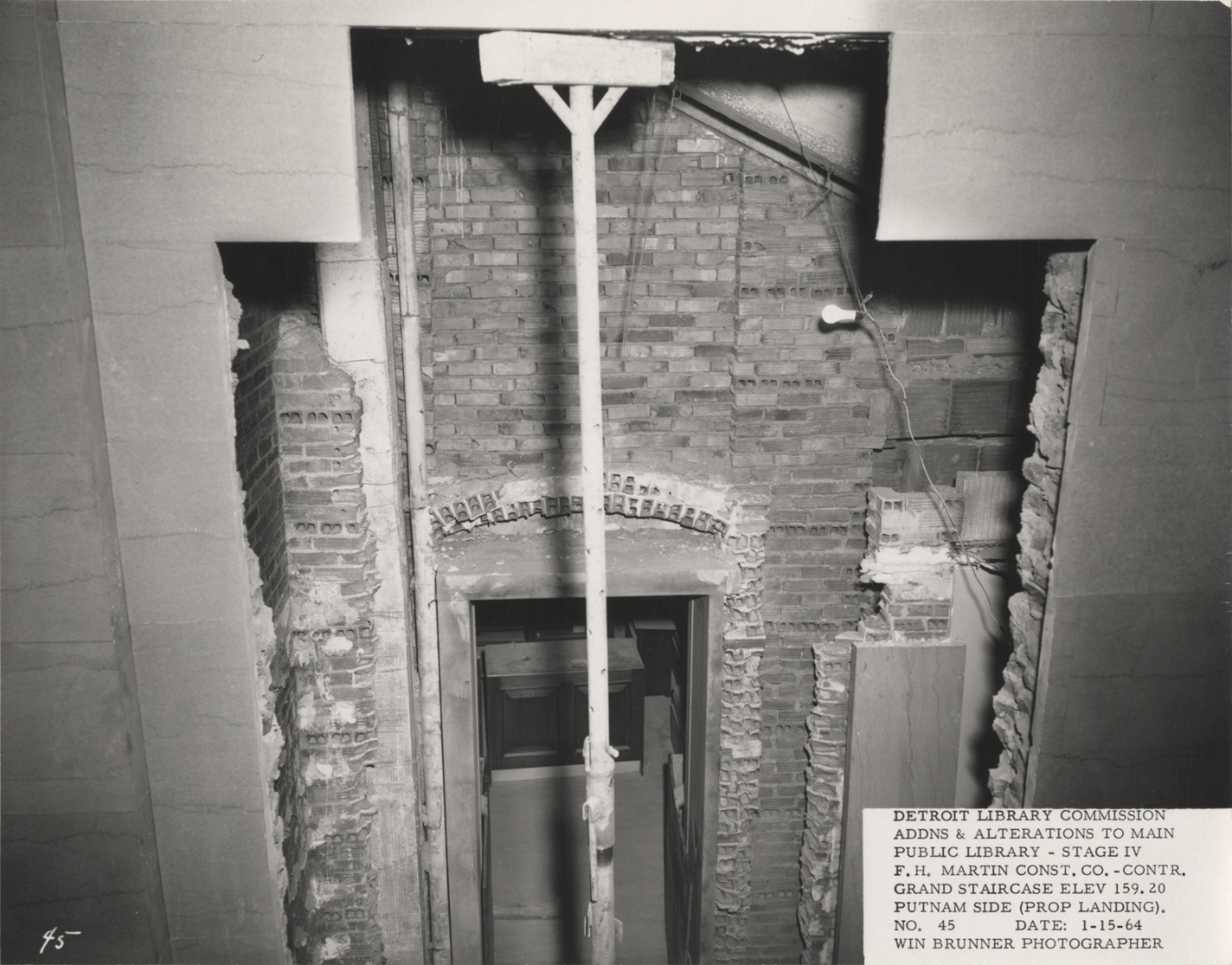 Grand staircase wall at Main Library during construction