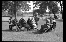 Woman playing accordion in park