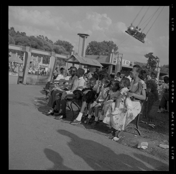 Woman sitting with children on park bench, Bob-Lo Amusement Park