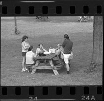 Group at picnic table, Bob-Lo Island