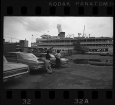 Women watching Bob-Lo ferry from parking lot