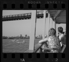 Passengers on Bob-Lo ferry watching motorboats