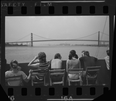 Passengers on deck of Bob-Lo ferry looking at Ambassador Bridge