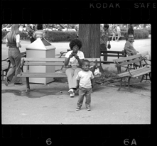 Woman photographing young boy, Bob-Lo Amusement Park