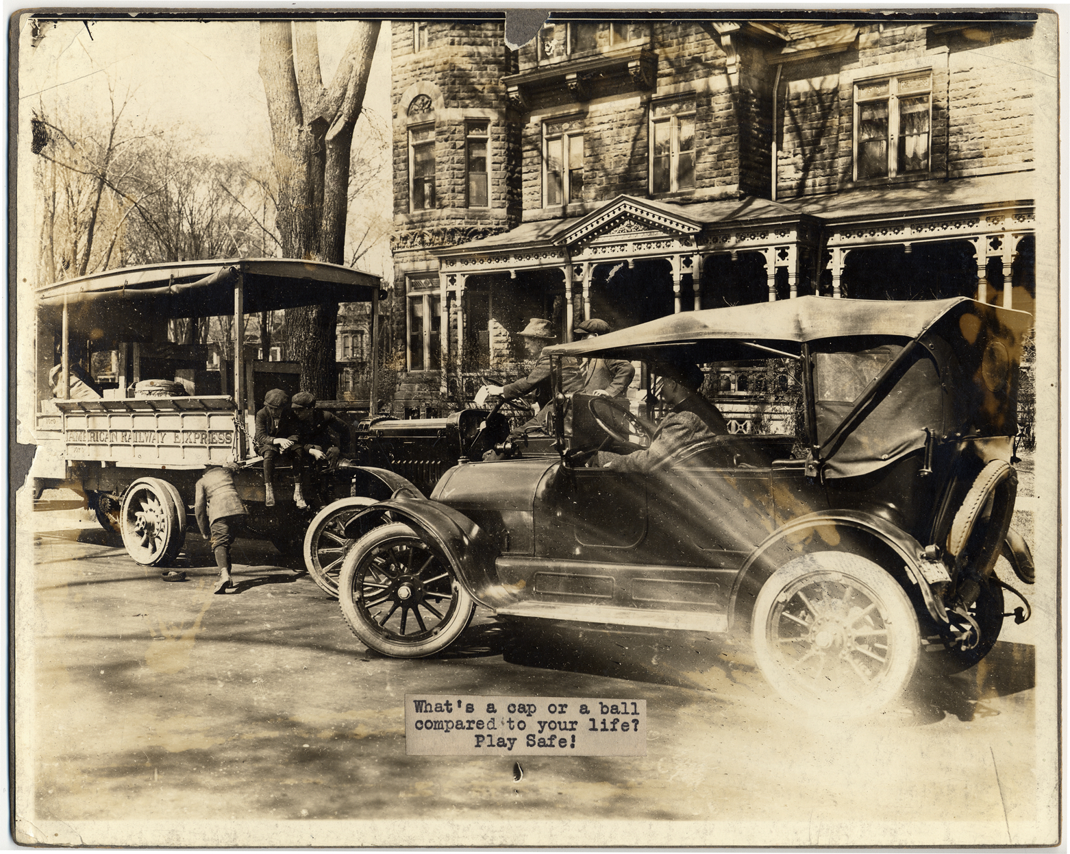 Boy in front of cars