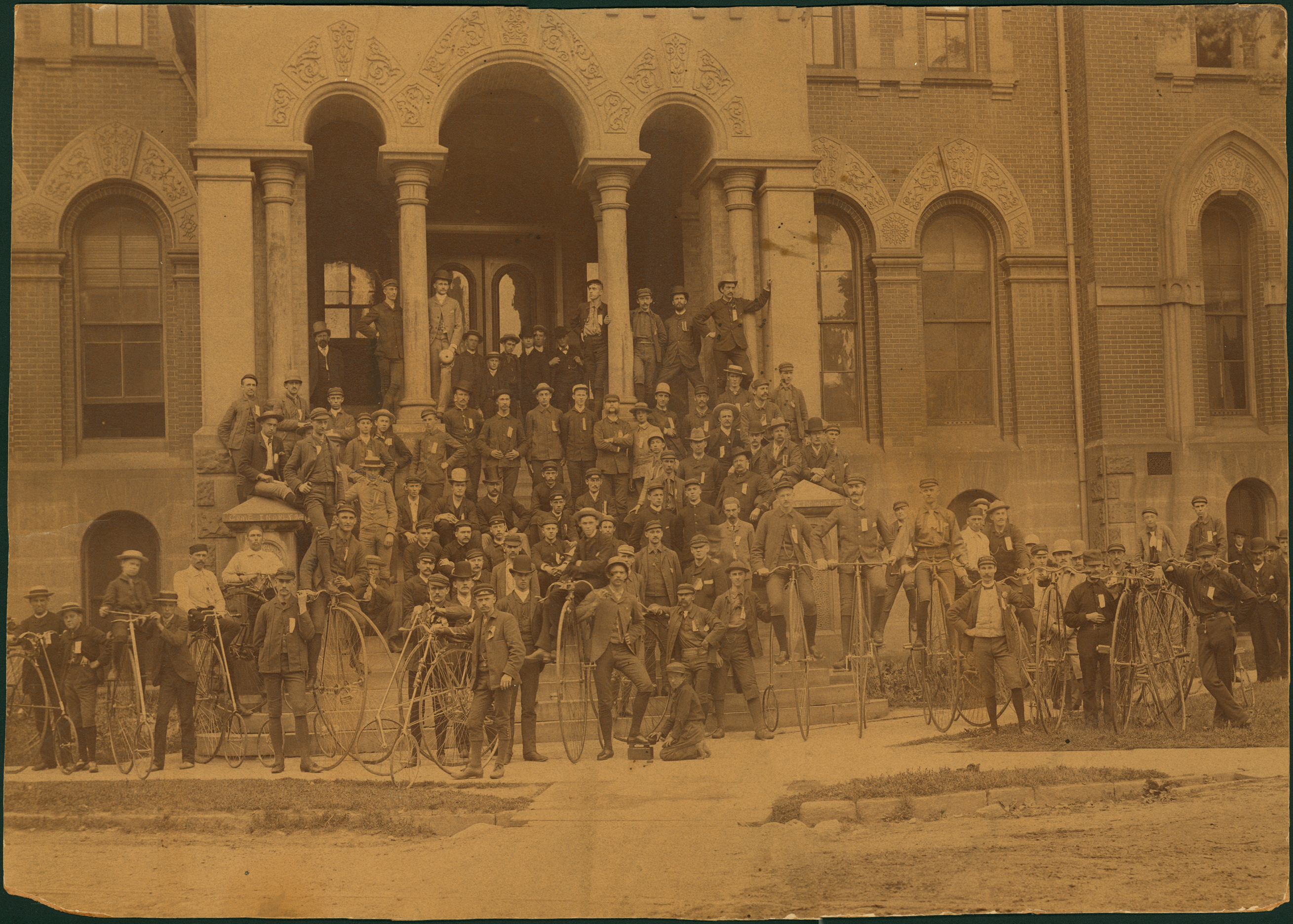 Bicyclists in front of building
