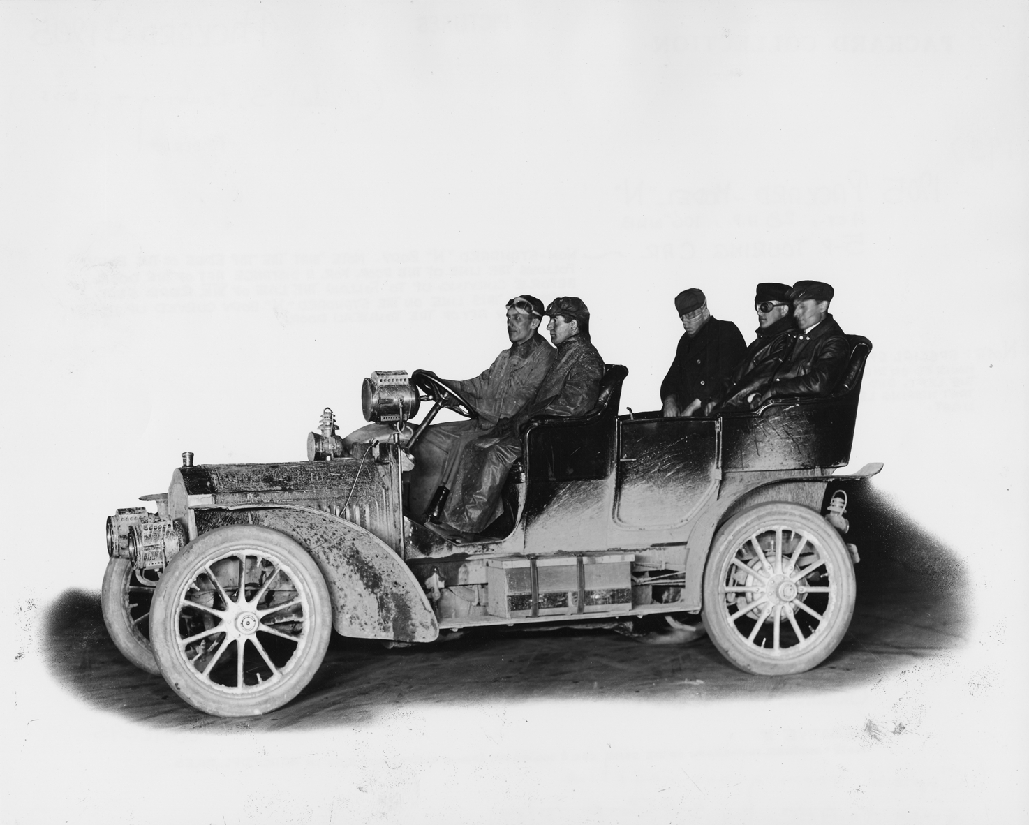 Driver and passengers in 1905 Packard Model N touring car