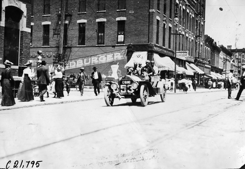 Car #53 on downtown street, 1909 Glidden Tour