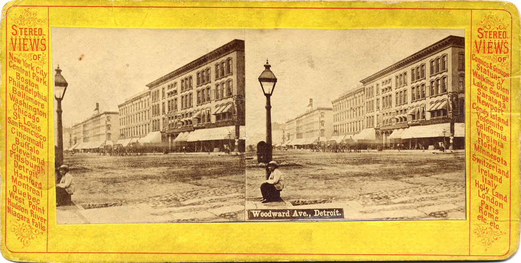 Boy beside street lamp on Woodward Avenue