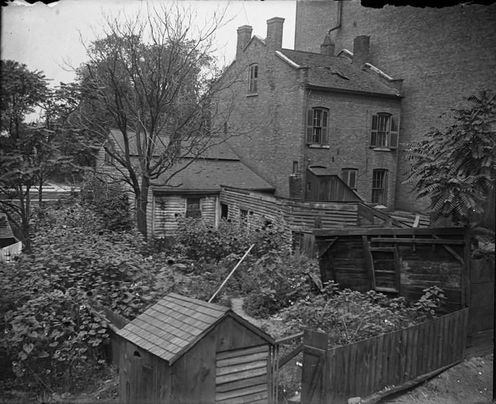 Brick colonial and wood frame houses