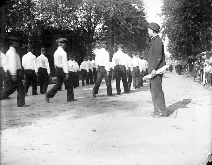 Group of uniformed men in parade