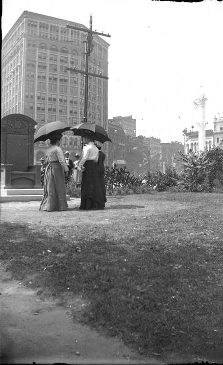 Two women with parasols
