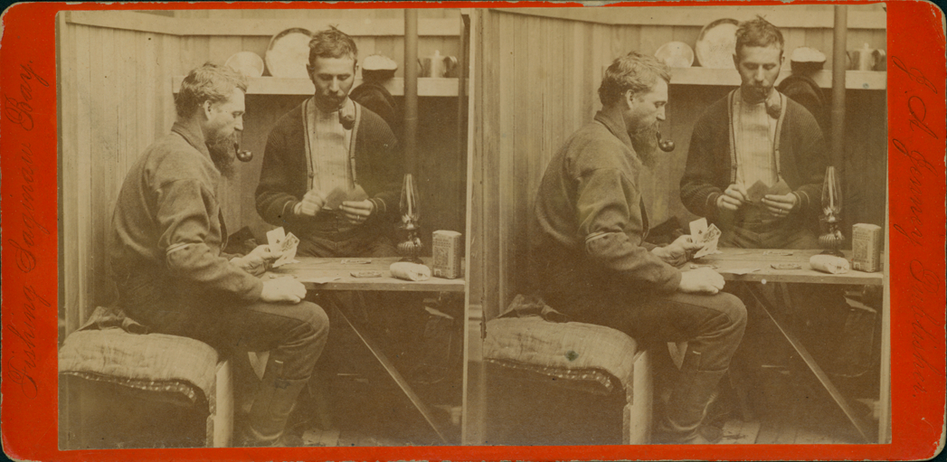 Fishermen playing cards inside fishing shanty