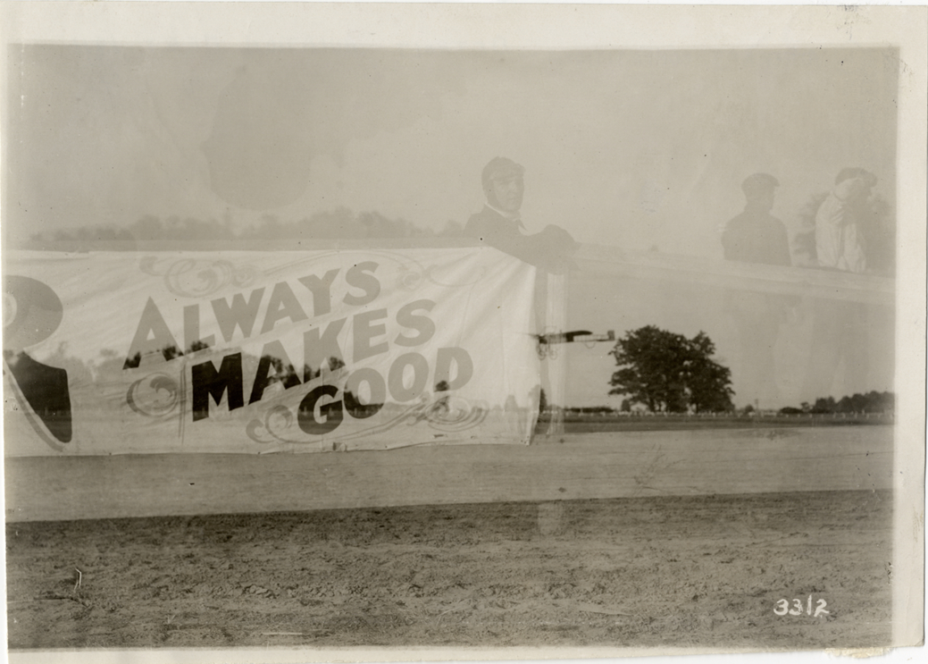 Aviator and banner at Detroit aviation meet