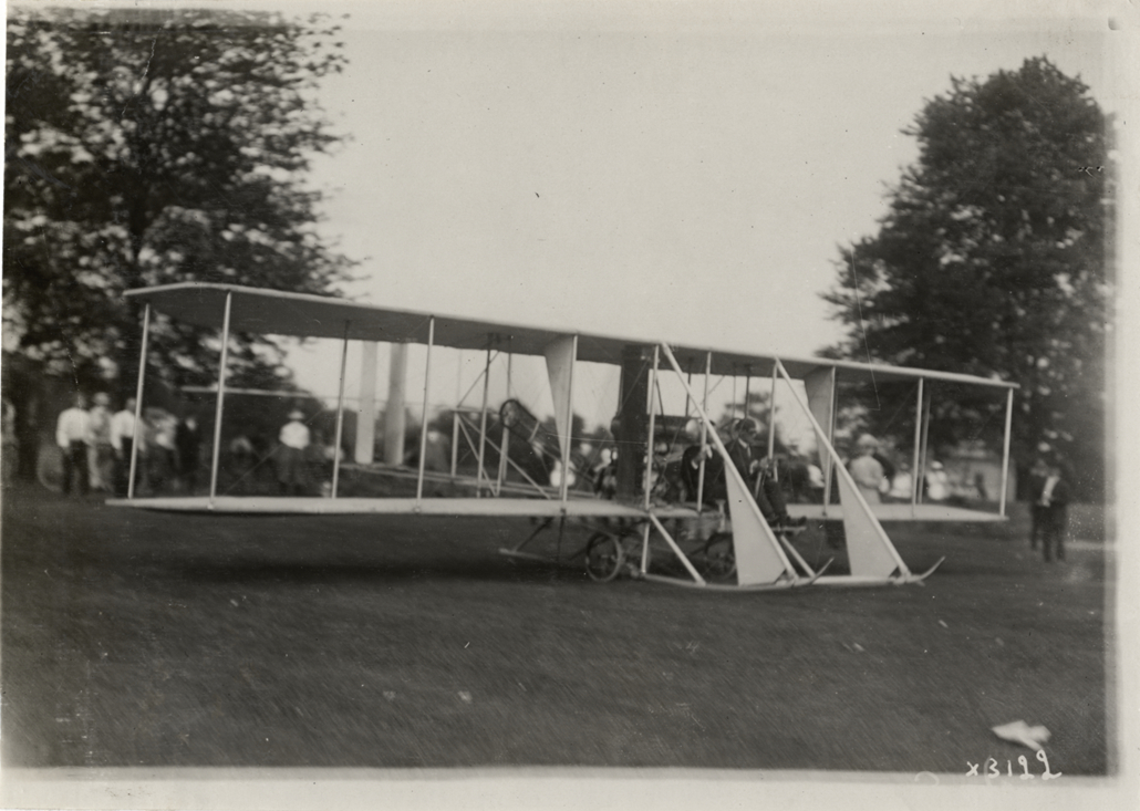 Men seated in airplane at Grosse Pointe aviation meet
