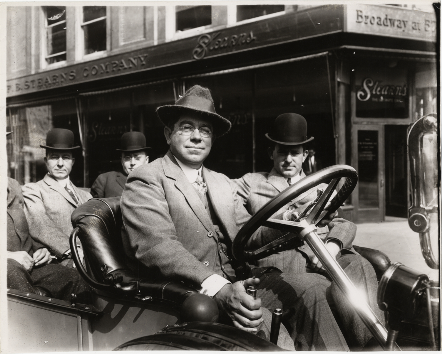 Charles J. Knight and passengers in Stearns automobile