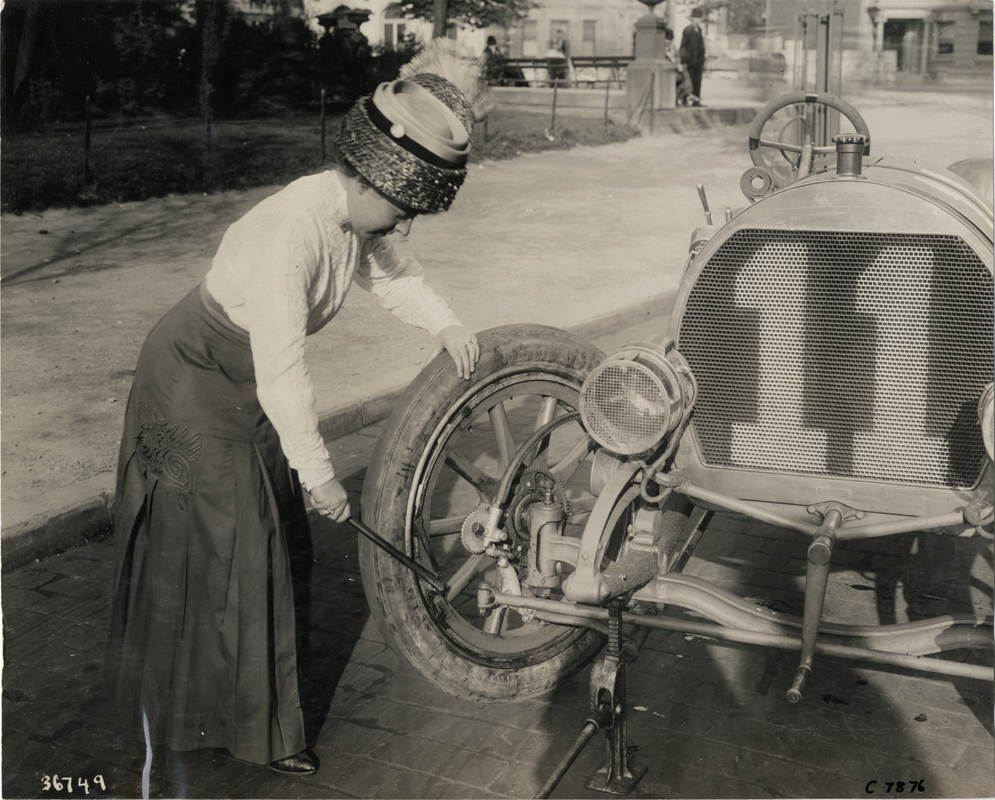 Joan Cuneo changing a tire