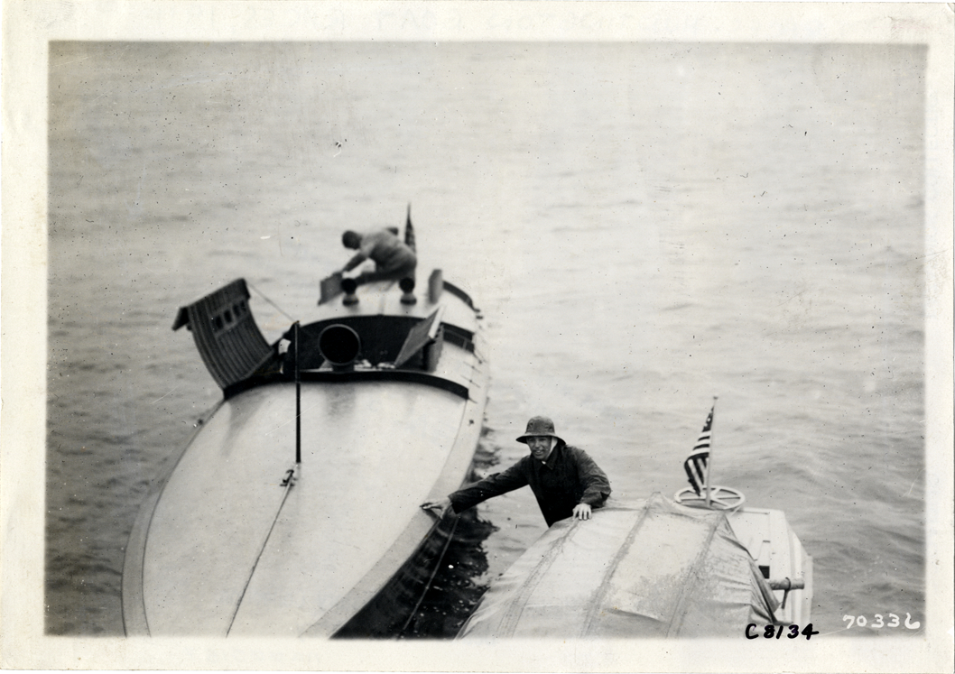 Men with two motorboats at Huntington boat races