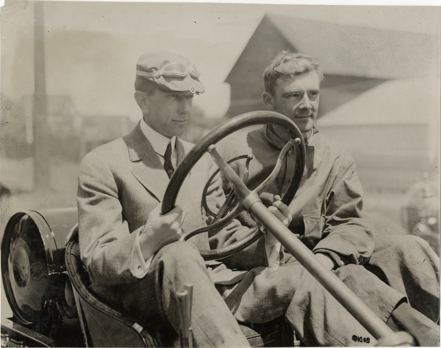 Two men in Hudson racecar
