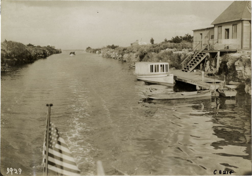 Boats and dwelling along river
