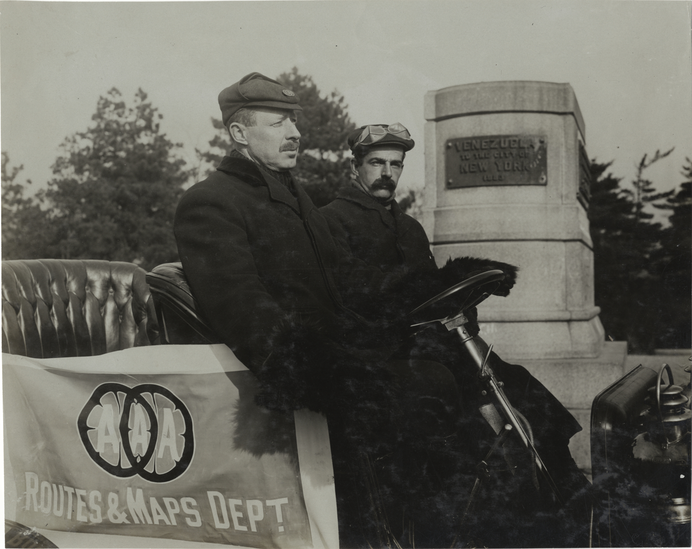 Motorists posing in Maxwell automobile