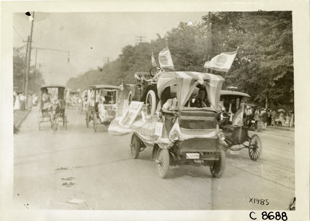 Truck carrying automobile in parade, Elks Club convention, Detroit, Michigan