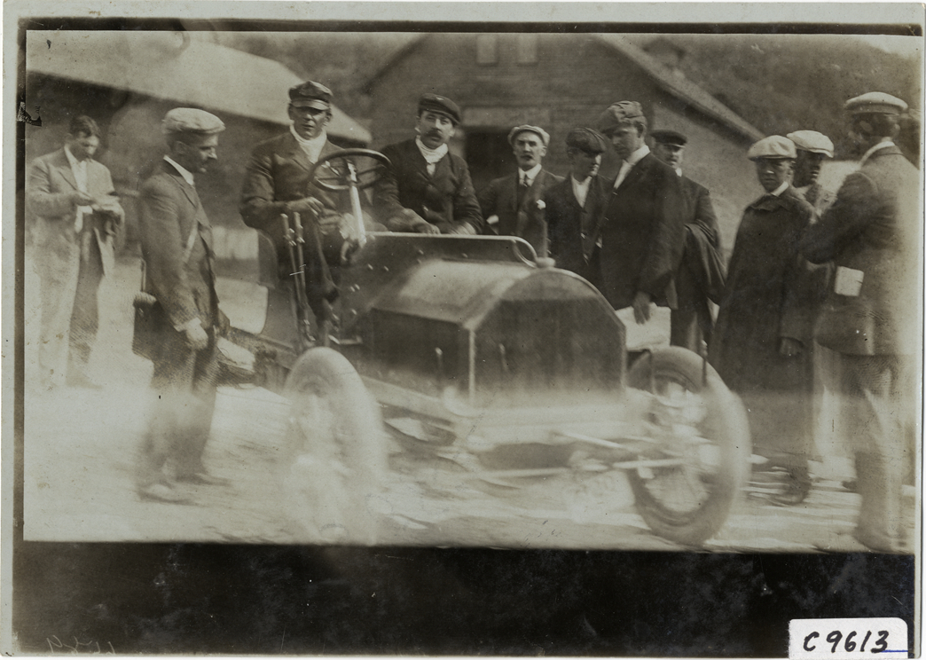 Driver in racecar, 1905 Climb to the Clouds Hill Climb