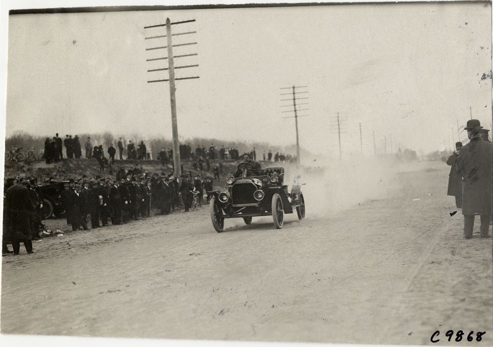 Driver in racecar, 1909 Fort George Hill Climb