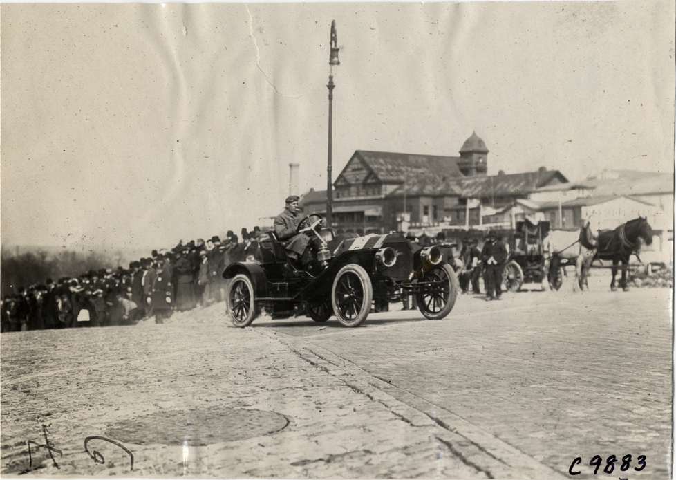 Driver in racecar, 1909 Fort George Hill Climb