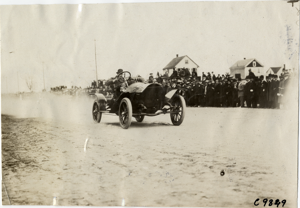 Driver in racecar, 1909 Fort George Hill Climb