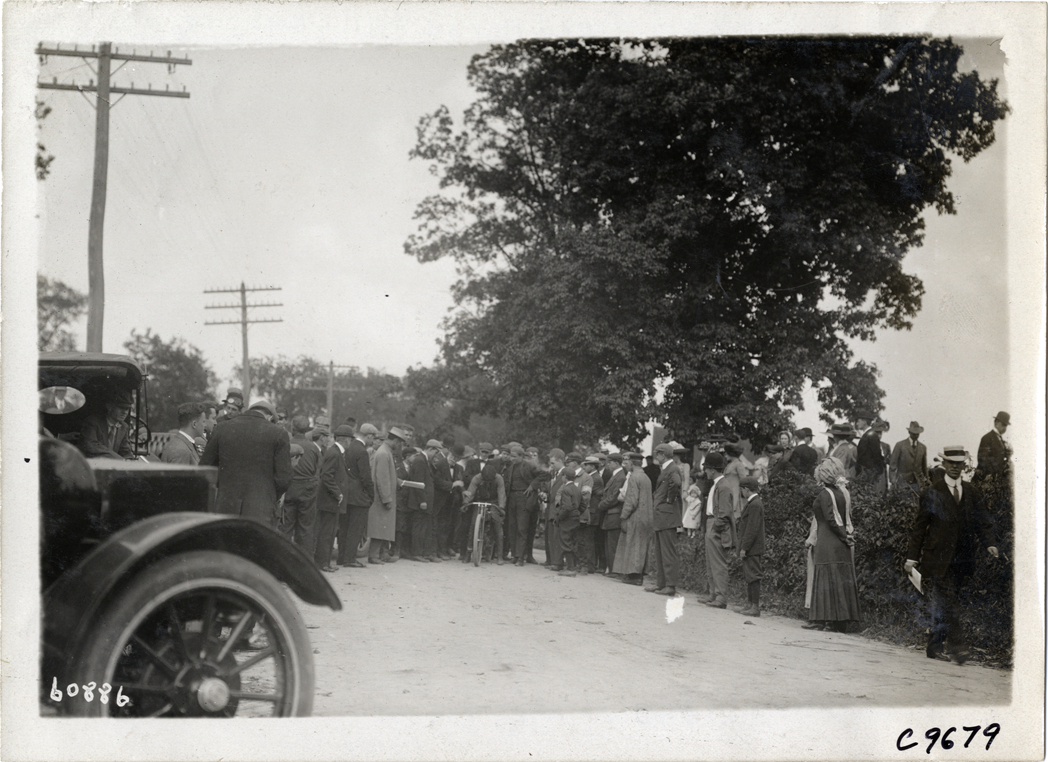 Crowd standing near motorcyclist, 1910 Dead Horse Hill Climb