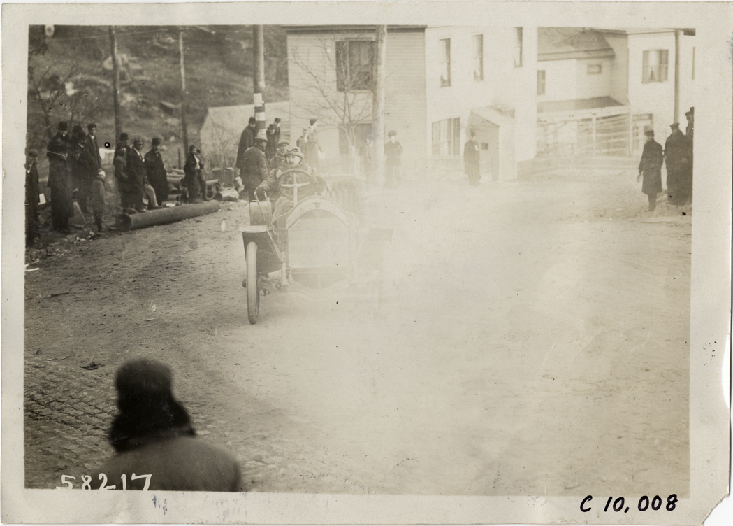 Driver in racecar, 1909 Edgewater-Fort Lee Hill Climb