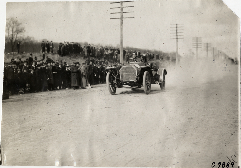 Driver in racecar, 1909 Fort George Hill Climb