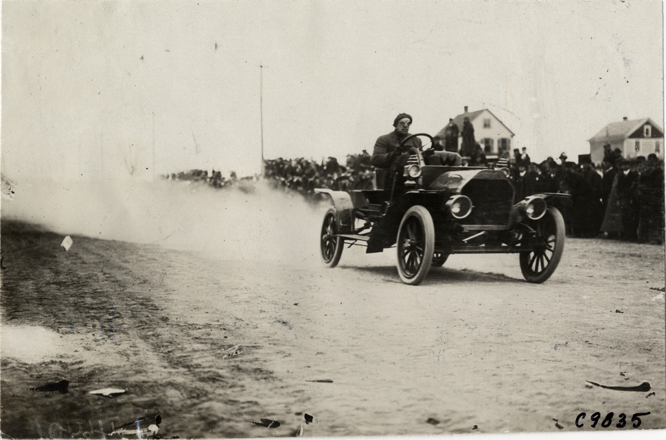 Driver in racecar, 1909 Fort George Hill Climb