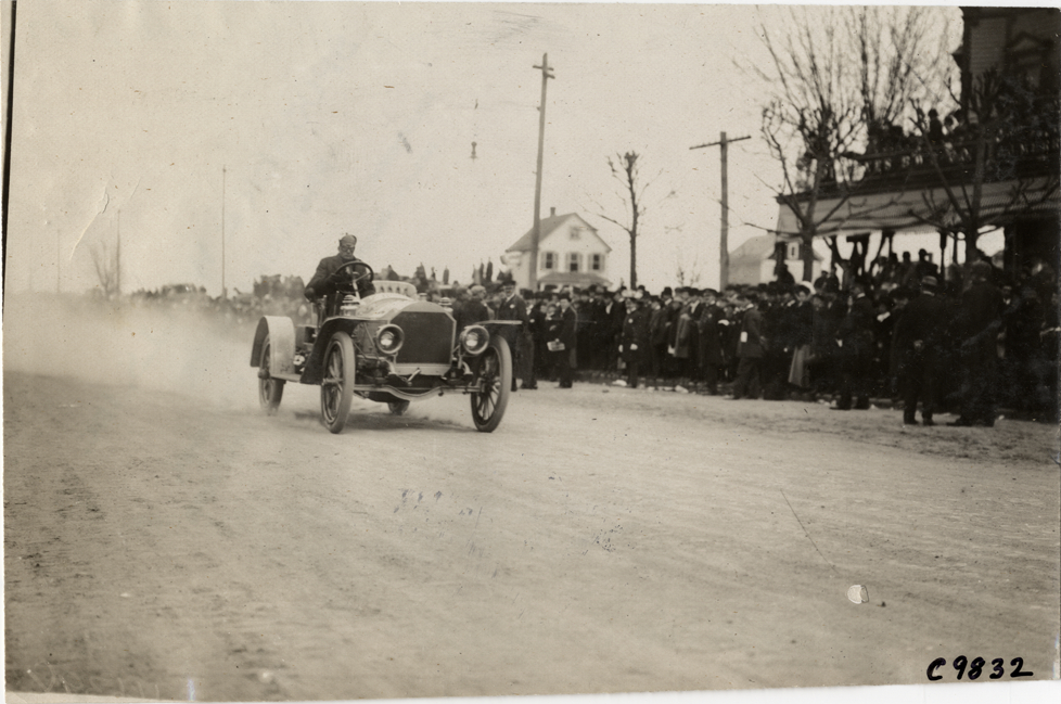 Driver in racecar, 1909 Fort George Hill Climb