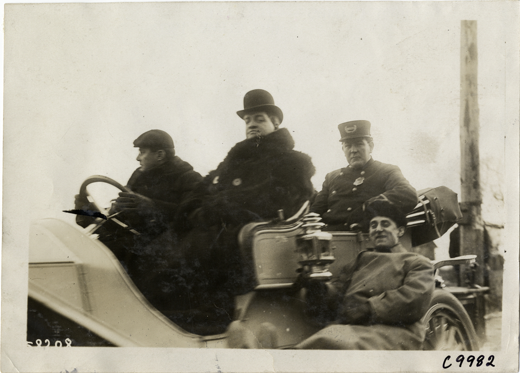 Men and policeman in racecar, 1909 Edgewater-Fort Lee Hill Climb