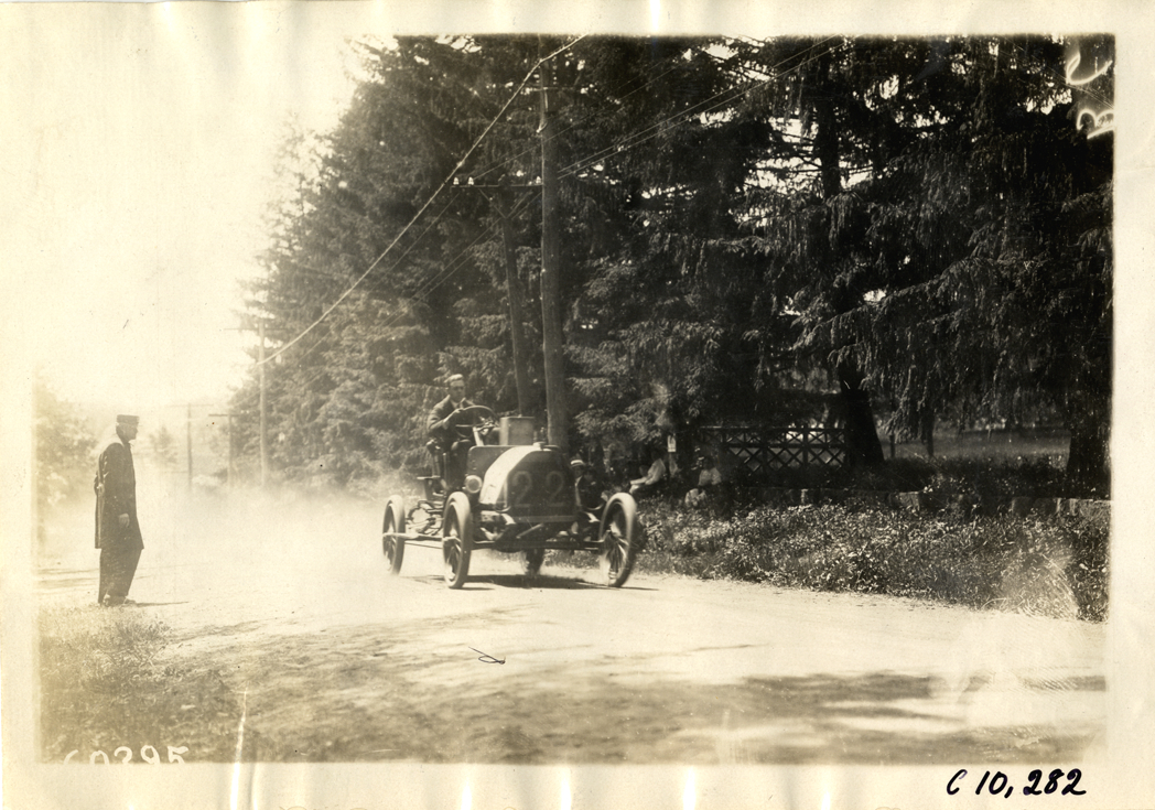 Driver in racecar, 1910 White Plains Hill Climb