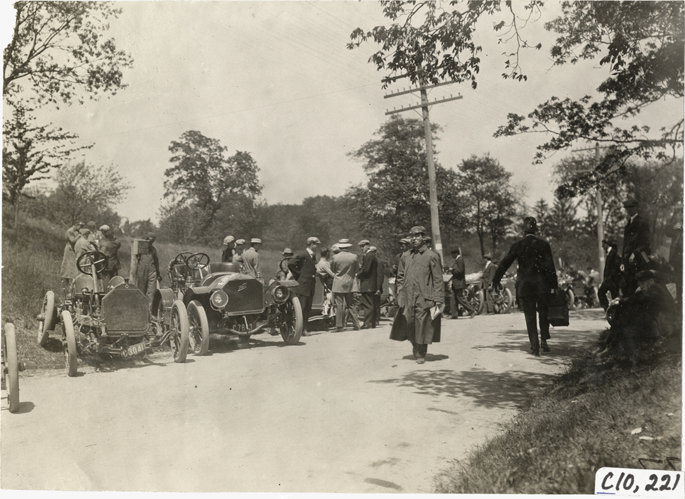 Racecars parked on roadside, 1909 Shingle Hill Climb