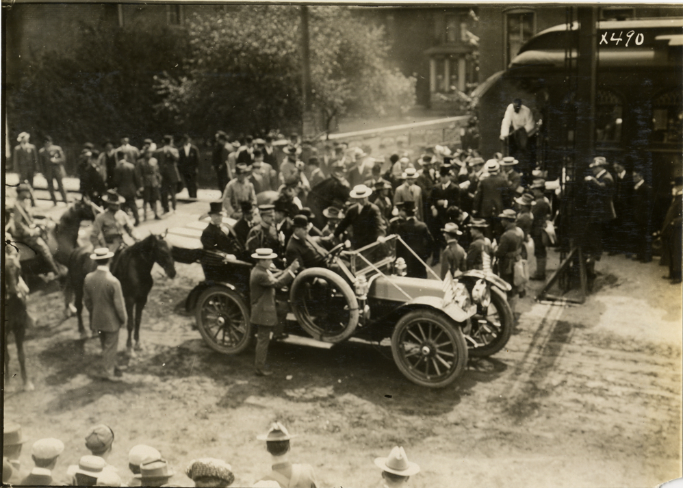 Automobile near train station, Custer memorial celebration