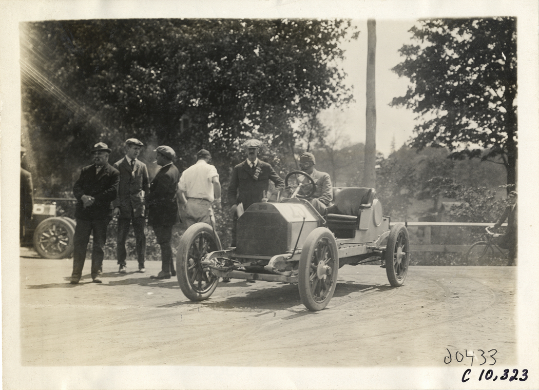Driver in racecar, 1910 White Plains Hill Climb