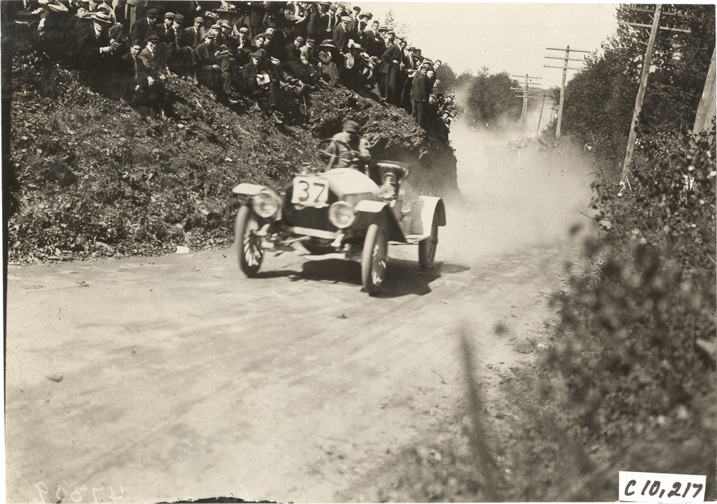 Driver in racecar, 1909 Shingle Hill Climb