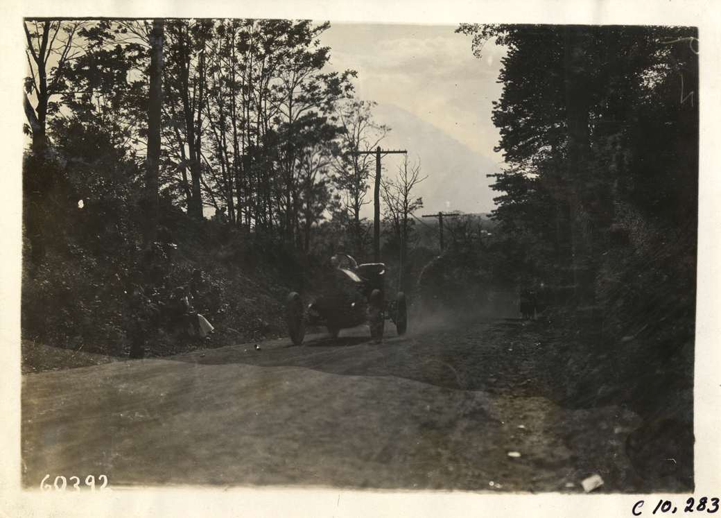 Driver in racecar, 1910 White Plains Hill Climb