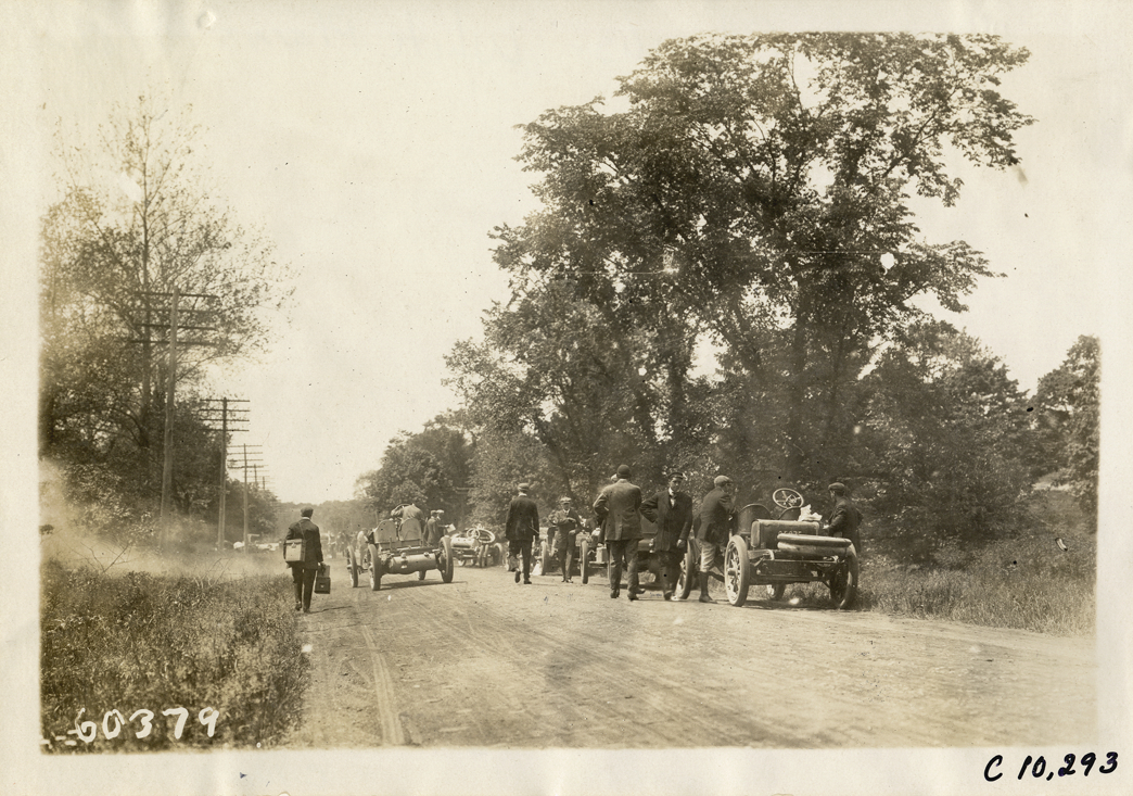 Racecars parked on roadside, 1910 White Plains Hill Climb