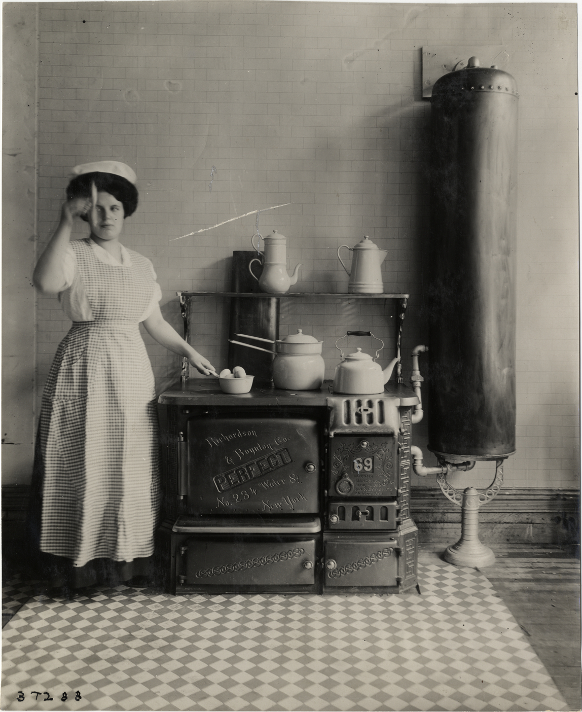 Woman with Richardson & Boynton Company stove