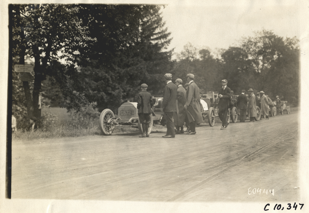Racecars parked on roadside, 1910 White Plains Hill Climb