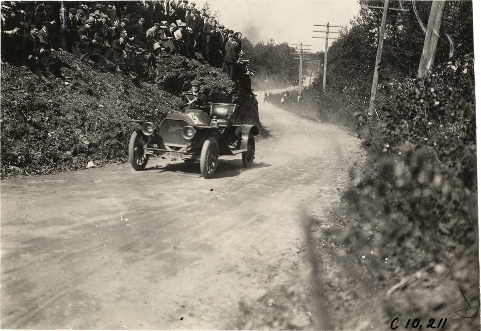 Driver in racecar, 1909 Shingle Hill Climb